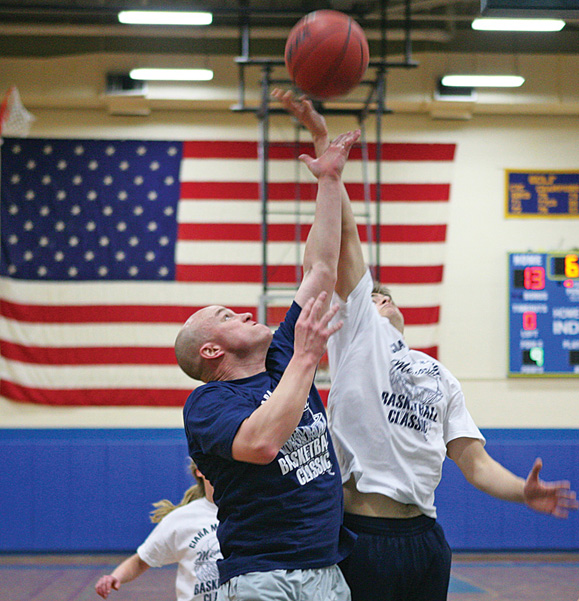 Ken O'Brien takes the tip-off for the Newington Police Department, during the fourth annual Ciara McDermott Basketball Classic at Newington High School.